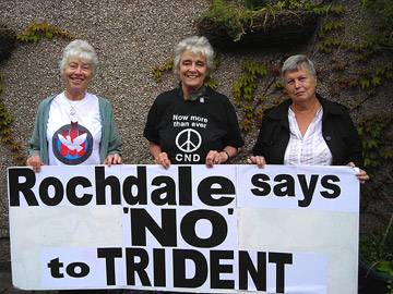 The three peace campaigners with a giant placard, ‘Rochdale says ‘NO’ to TRIDENT’