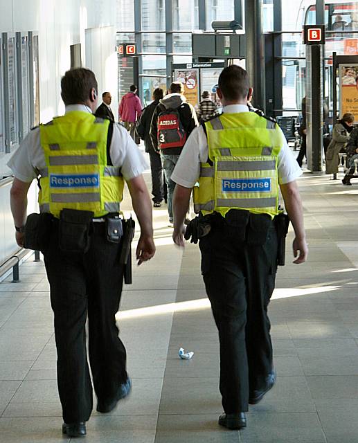 Two members of the Patrol and Response Unit on duty at a Greater Manchester bus station.
