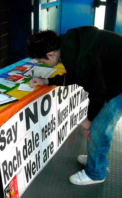 A supporter signing his postcard to the foreign secretary, 7 November 2009 