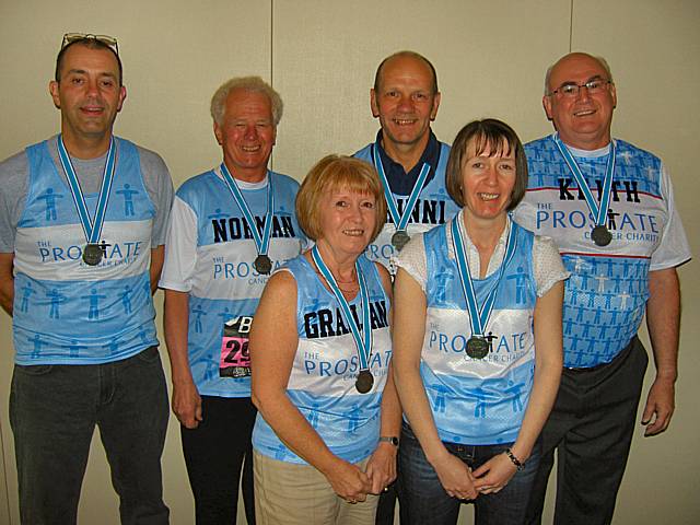 Six members of the Rotarians' team of runners proudly showing off their shirts and medals.  From left to right; Kit Wellens; Norman Wellens; Janice Powell; Keith Trinnaman; Debbie Humphries; Keith Powell.