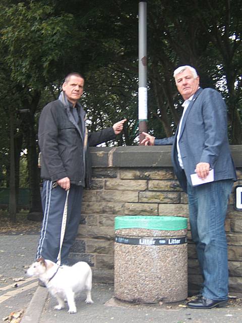 Ian Duckworth (right) with Eddie Schenk, a park user of Thirlmere Road Castleton, pointing out the planning application for the driving range currently on display outside the park. 