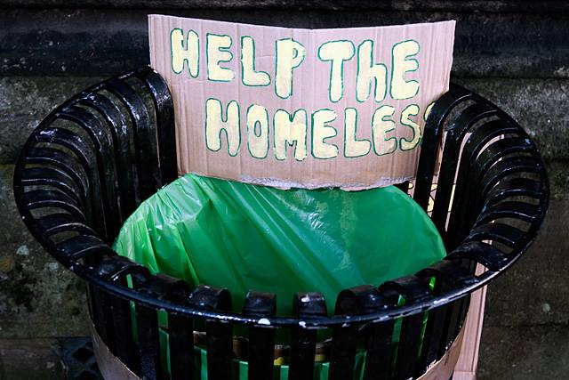 A 'help the homeless' placard