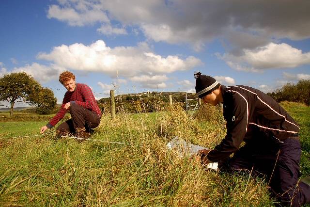 Graduate volunteers Daniel Jessop (21, left) and Robert Birtwell (21, right) surveying at Lower Dunishbooth in Rochdale