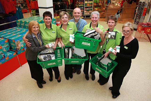 Asda colleagues with Mind and Body Natural Health Centre in Bury staff pictured at Asda store, Rochdale. 
Left to right, Andrea Lowe, (Manager at Health centre), Eileen Shippam, Chris Powell, Barry Todd (Health Centre), Dorothy Meyrick, Geri O Hara and Rachel (store services manager) 
