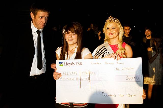 Miss Rochdale Frankie Whitworth presents Rochdale's Got Talent winner Ellysse Mason with a cheque for £500 with compere Keith Rudman looking on