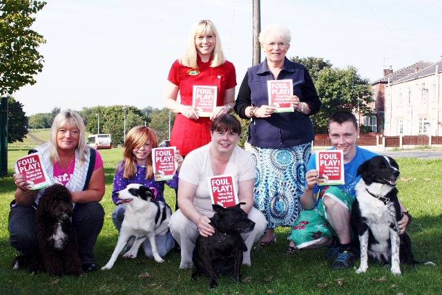 Local residents and dog walkers support the Foul Play campaign to show dog fouling the red card