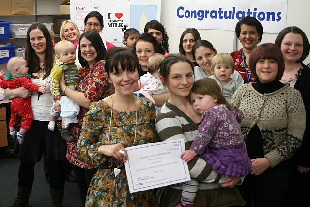 The peer support volunteers and their babies with Emmerdale star Zoe Henry, centre, at the celebration event