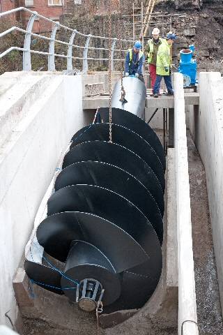 The screw being put into place for hydro-electric interchange 