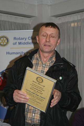 Terry Smith collecting the Community Award from the Rotary Club of Middleton