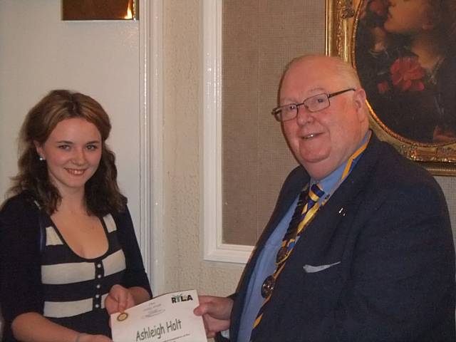 Asliegh Holt being presented with her RYLA certificate by Middelton Rotary President Jeff Lawton