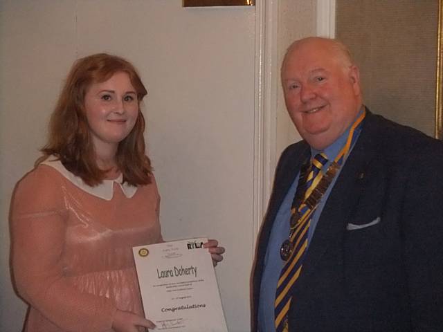 Laura Doherty being presented with her RYLA certificate by Middelton Rotary President Jeff Lawton