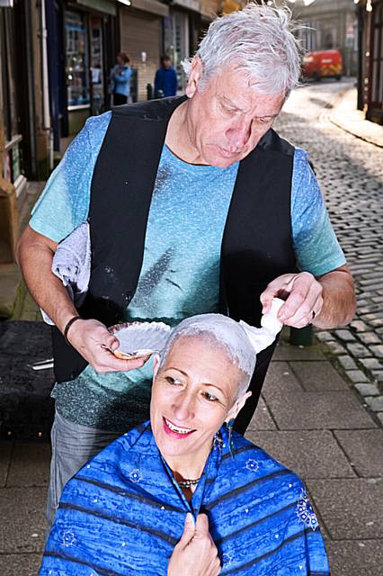 Isabelle Walker-Lefebvre having her head shaved by John Peers