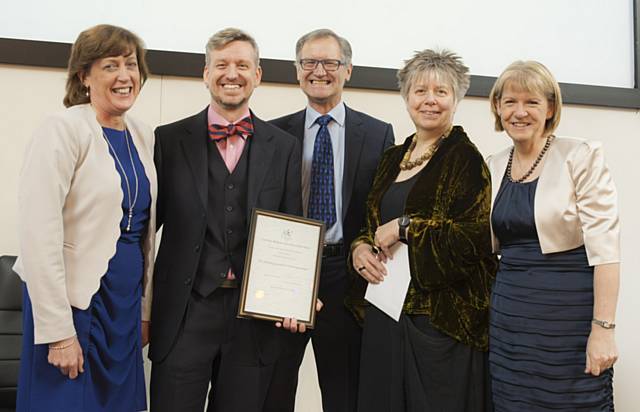 Dr. Sean Pert (second from left) accepts the award with Carol Stow (fourth from left) looked on by the Deputy Chair of the Royal College of Speech and Language Therapists (RCSLT) Maria Luscombe, RCSLT President Sir George Cox and RCSLT Chair Bryony Simpson