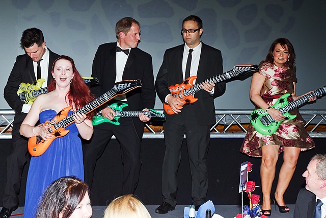 'Volunteers' from the guests on stage for the warm up<br \>Rochdale Business Awards 2012