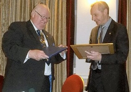 Jeff Lawton, President of Rotary Club of Middleton presenting the Paul Harris Award to Peter Hayward