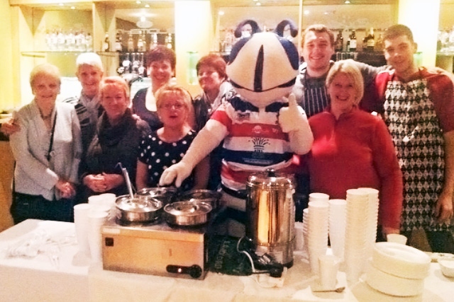 Helpers and Hercules the Hornets mascot at the Flying Horse soup kitchen 