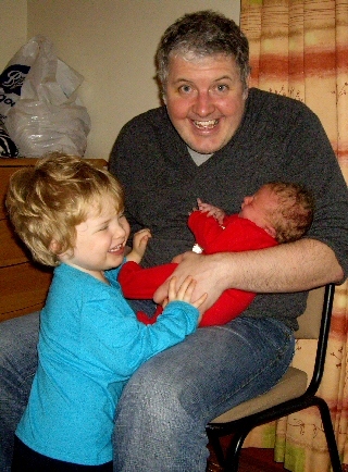 Councillor Mulgrew with his son Tristan and new baby daughter Lorelai