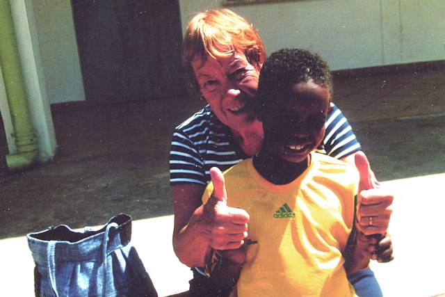 Anne McNicholas with a child during her last visit to Ethiopia