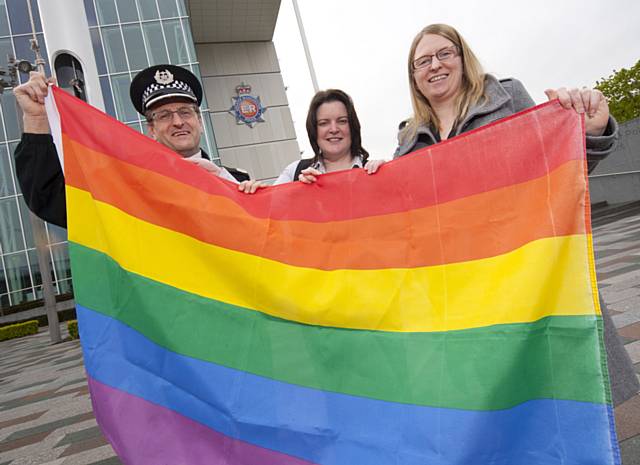 ACC  Ian Wiggett and representatives from LAGSA (Lesbian and Gay Staff Affiliation) about to raise the rainbow flag outside the Force Headquarters