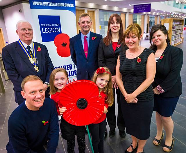 Poppy Hunt (front left) and Poppy Rigg both pupils at Bamford Academy joined Antony Cotton, Councillor McCarthy, David Forbes and council staff to launch the annual poppy appeal in Rochdale