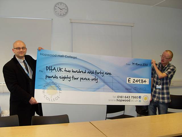 Jake Beattie receiving the PHA charity cheque