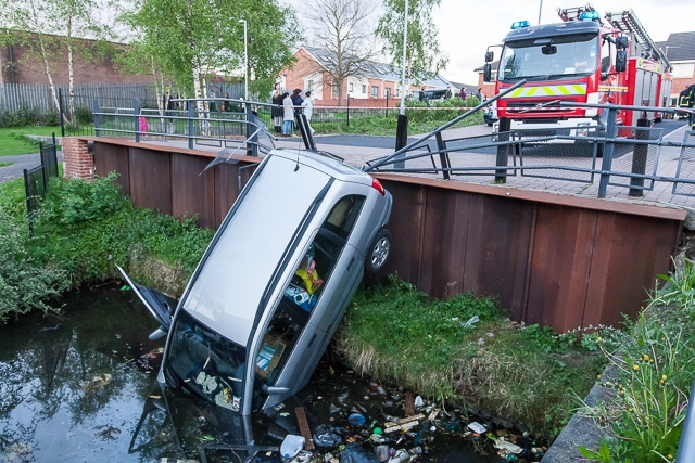 The car demolished the barriers and nosed dived into the canal