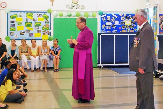 Bishop Mark Davies talking to the children