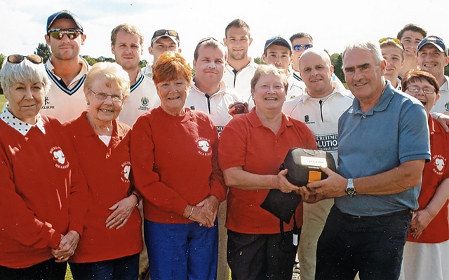Rochdale Heartbeat presenting an anniversary defibrillator to Rochdale Cricket Club