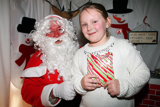 Abigail Schofield meets Father Christmas at Milnrow Parish Church Christmas Fair