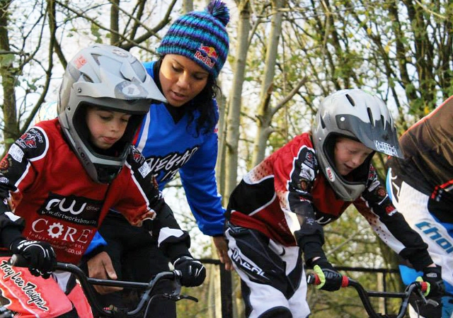 Young BMX riders Oliver Stansfield and Joe Matthias being coached on the gate by Shanaze Reade