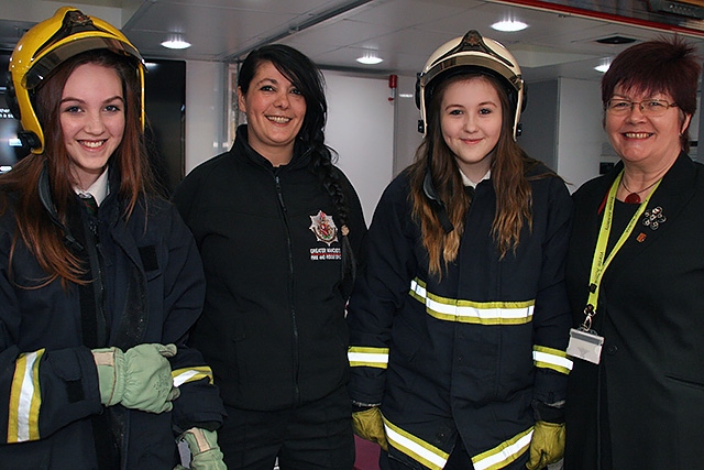 Madison Taylor, Charlotte Whittaker and Mrs (Janet) Emsley from Wardle Academy with a Greater Manchester Fire and Rescue Service staff member