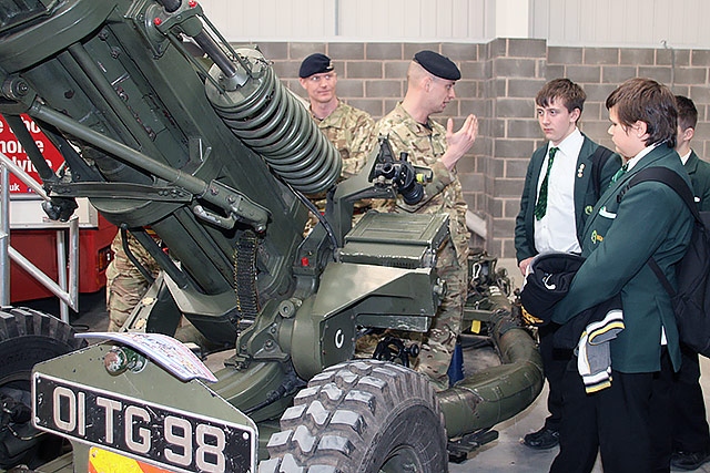 Students talk to soldiers at the Armed Forces stand