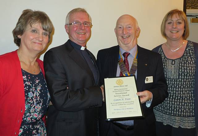 Mary Feist, Reverend Canon Nick Feist receiving his Vocational Award from Rotary Club President, Stuart Sawle and Sue Furby, Chair of the Youth and Vocational Committee