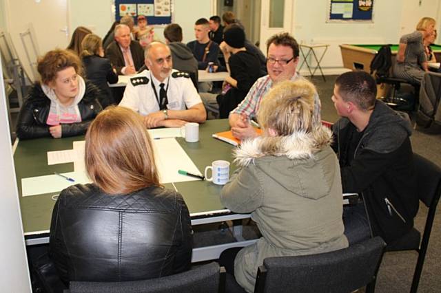 GMP Chief Inspector Nadeem Mir (centre left) and Cllr Andy Kelly (centre right) discuss the issue of how young people are judged on their dress
