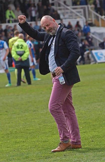 Manager Keith Hill in his pink pants and a smart jacket