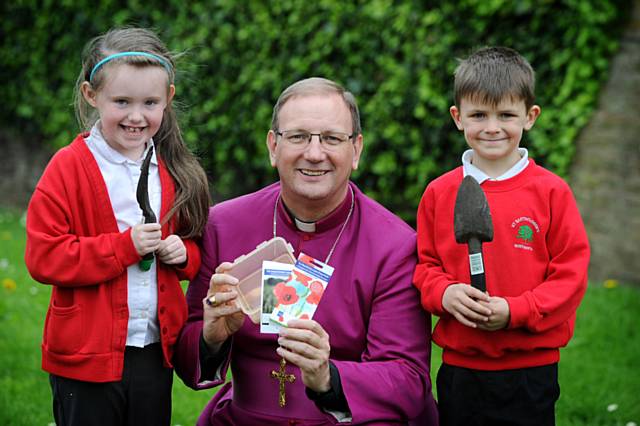 Angel Alexander aged 7 and Kaiden Standring aged 7 with the The Bishop of Middleton Mark Davies 