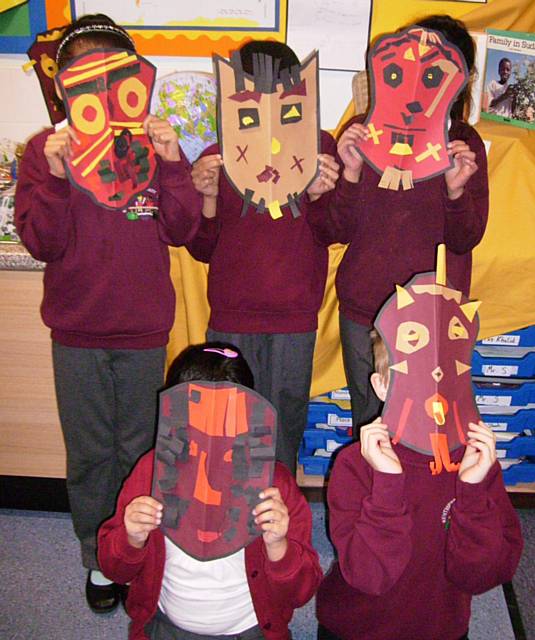 Year 2/3 class with their African tribal masks