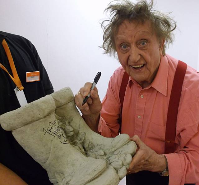 Ken Dodd signing Jimmy’s replacement set of concrete wellies at the Spa Theatre in Bridlington
