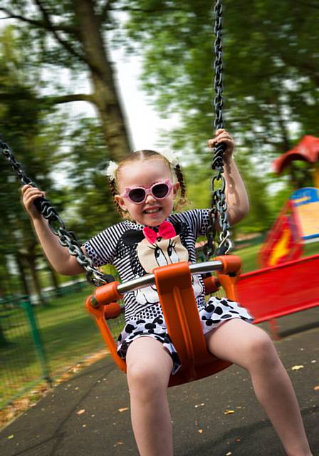 Abigail McMahon enjoys the swings at Truffet Park in Langley
