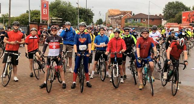 Scott Williams (in Superman outfit) and his friends on the bike ride to raise money for Brain Tumour Charity