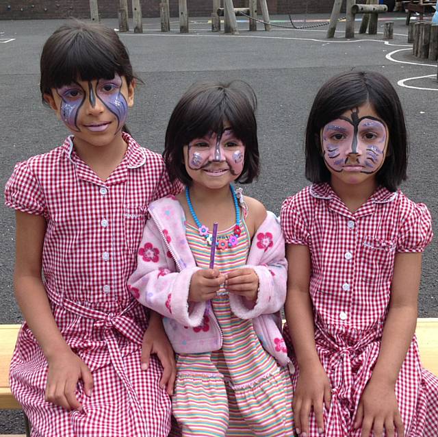 Zayna, Inayah and Alina – face painting with their painting faces 
