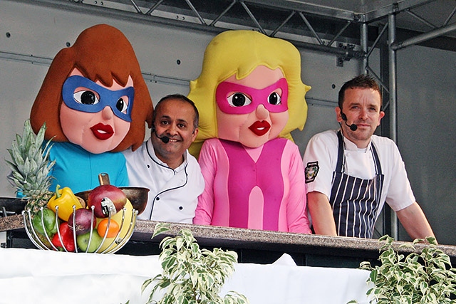 Feel Good Festival 2014 - Chefs Aazam Ahmad and Peter Clough on the celebrity kitchen stage with members of the All Star Squad