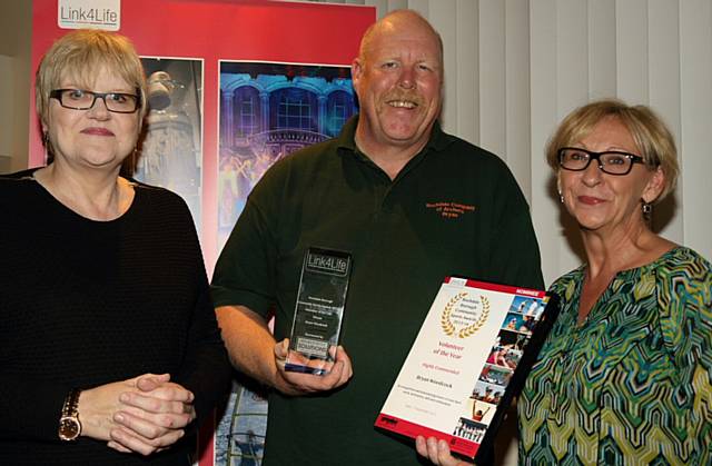 'Volunteer of the Year' winner Bryan Woodcock receiving his award from Recruitment Solutions (Northwest) Ltd