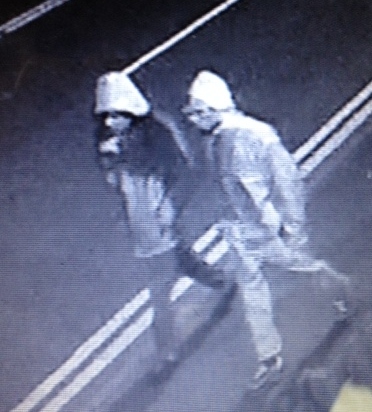 CCTV image of suspects believed to have robbed a petrol station with a hammer