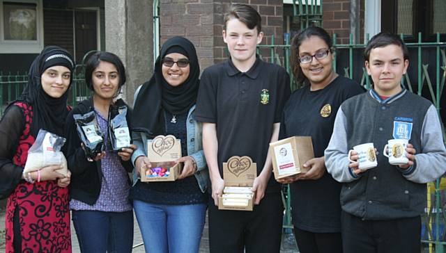 Zenab Ali, left, with the other youngsters from Not Just a Little business and some of their products