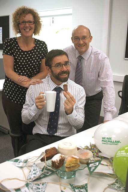 Staff enjoying the coffee morning - Lorna Tunstall, Paul Wychrij and Darren Kirwin (with the mug and biscuit)