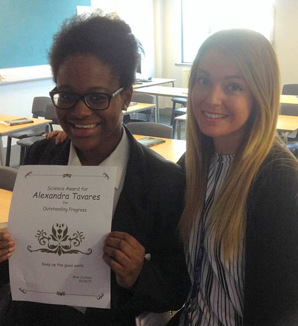 A Tavares awarded outstanding progress certificate from her teacher Miss Jackson
