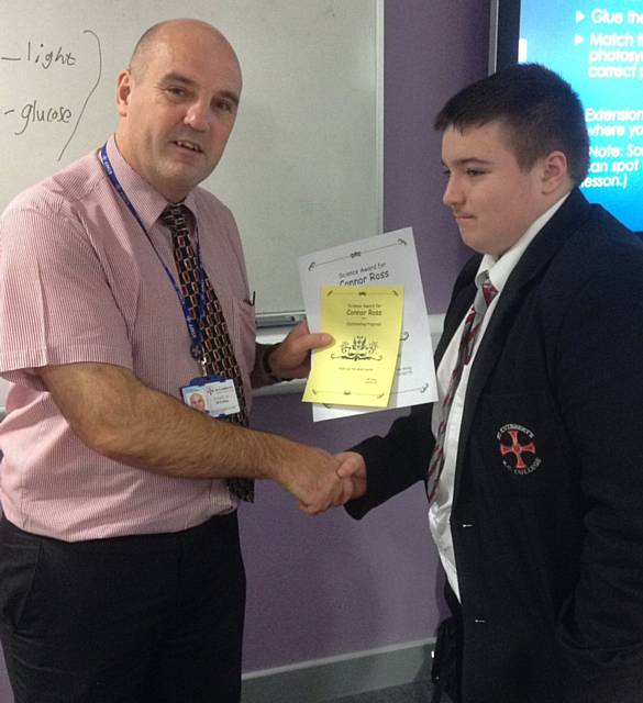 C Ross awarded outstanding progress certificate his teacher Mr Riley

