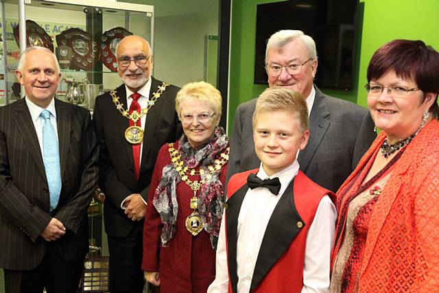 Wardle Academy Youth Band member Adam Warburton with Councillor Ashley Dearnley, Mayors of Rochdale, Oldham, Whitworth and Councillor Janet Emsley