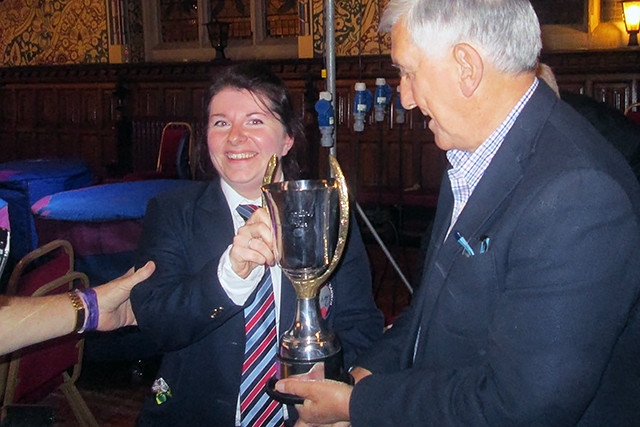 Rochdale Festival of Brass<br /> NWABBA President Malcolm Brownbill presenting the champions trophy to Vicky Lee Ahmed of winning band Blackburn and Darwen